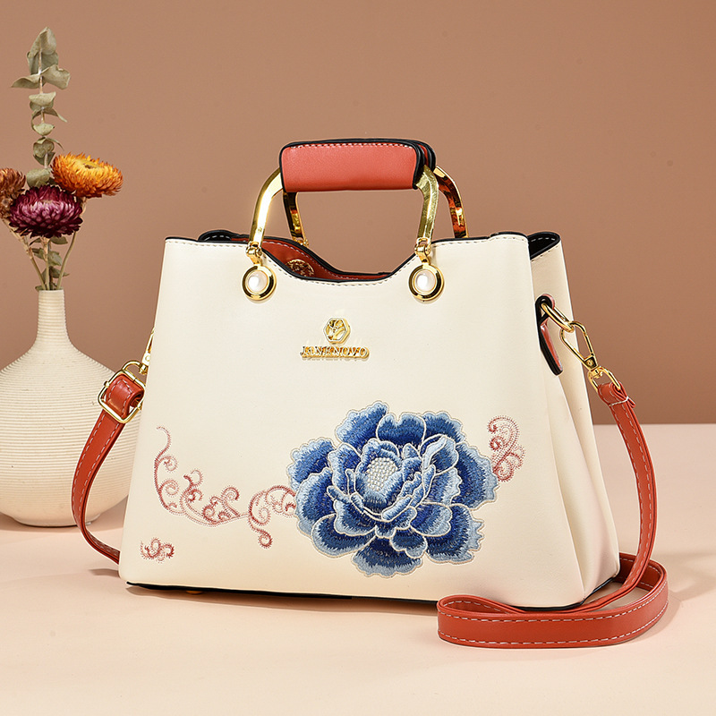 Regalo de temperamento de nicho para mamá 2025 nuevo estilo para suegra y ancianos bolso de hombro bordado elegante y de moda