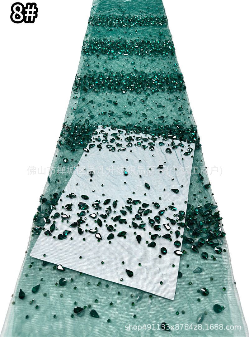 Tejido de malla de diamante de gota de agua laminada mano pesada clavos taladro de cola de pescado vestido de noche tela de boda en stock