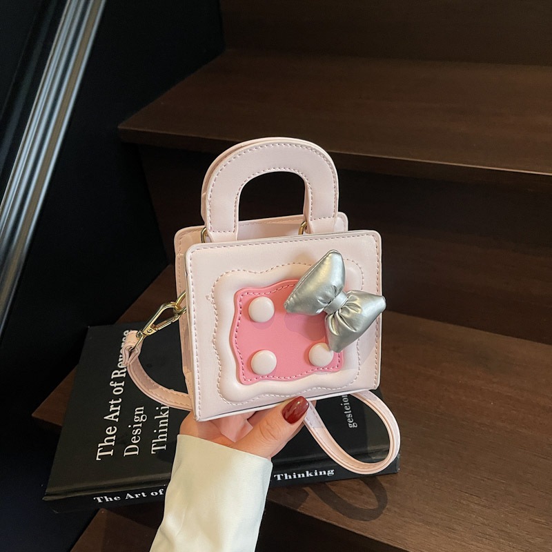 Bolso lindo japonés 2025 primavera nuevo bolso femenino lazo en contraste bolso de hombro mini bolso de mensajero para niños