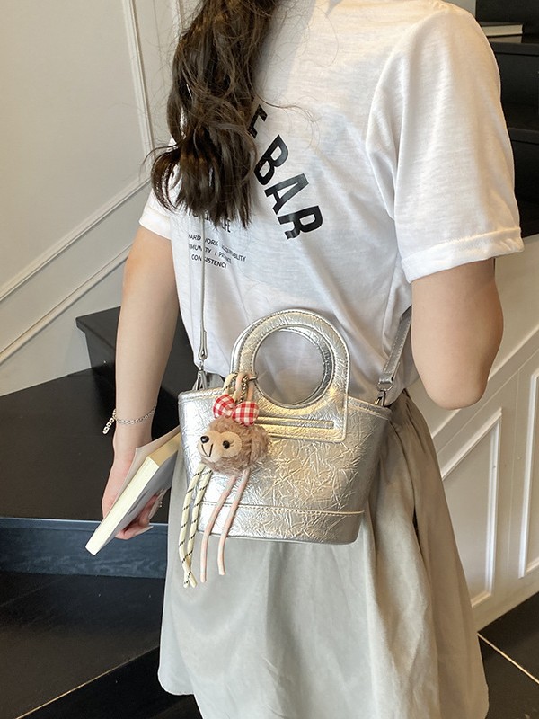 Bolso para mujeres 2026 nuevo nicho coreano de comida de mano cesta bolsa de cubo de textura alta de viaje mochila de hombro