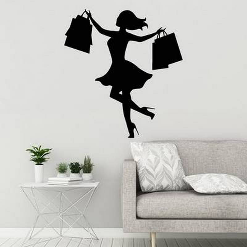 Fashionable shopping bag on wall