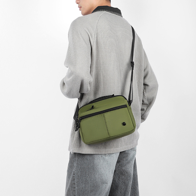 时尚新款简约斜挎包女休闲潮流单肩斜挎布包轻便男士运动单肩包