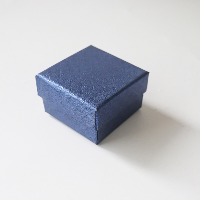 Nueva caja de papel pequeña de margarita, joyería de franela de alta gama, joyería, anillo, pendientes, caja de embalaje universal al por mayor