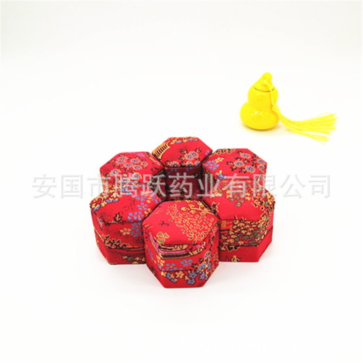 Hexagonal Brocade Gift Box Red Silk Covered Empty Pill Packaging Case in use