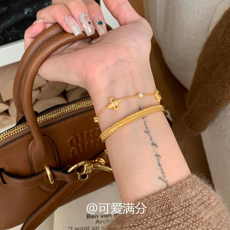 「金玉良縁」中古の金色のアイリスのブレスレットの高い顔の値は少しジルコンを入れてプレゼントします。|undefined
