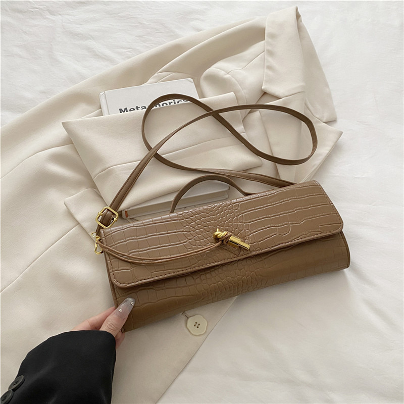 2025 verano temperamento tendencia nuevo temperamento bolso de palo francés con bloqueo diagonal bolso horizontal bolso de mensajero de un solo hombro bolso femenino