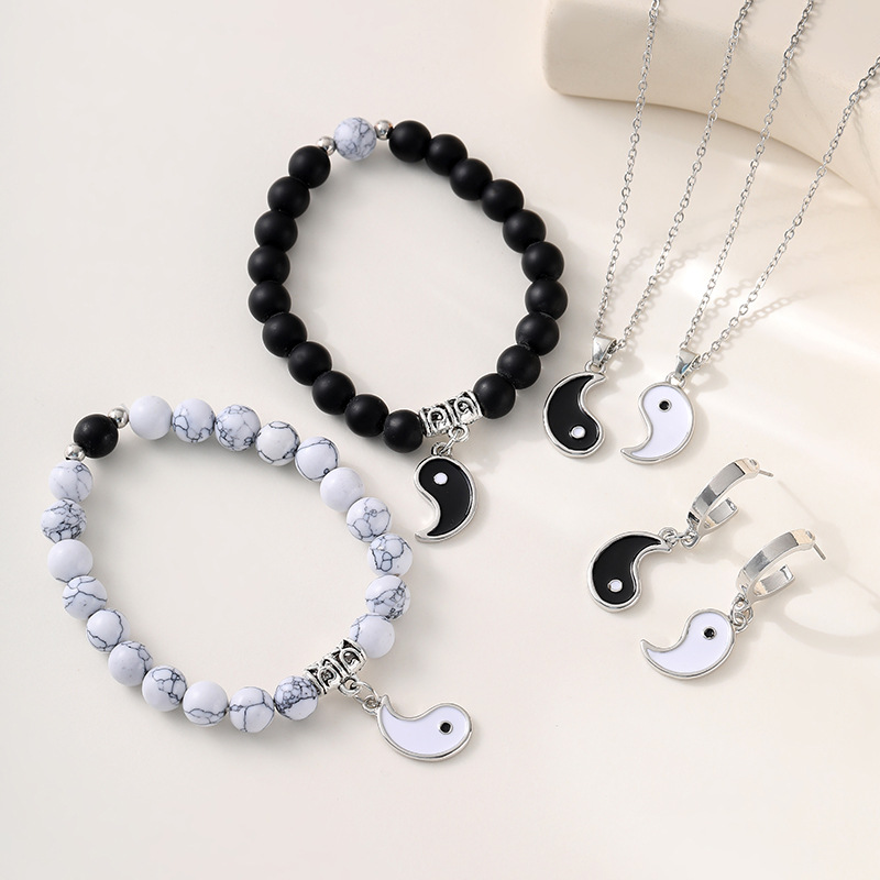 Amazon explosivo Yin Yang goteo de aceite blanco y negro Tai Chi para parejas colgante pulsera negro esmaltado blanco pino un par de pulseras transfronterizas