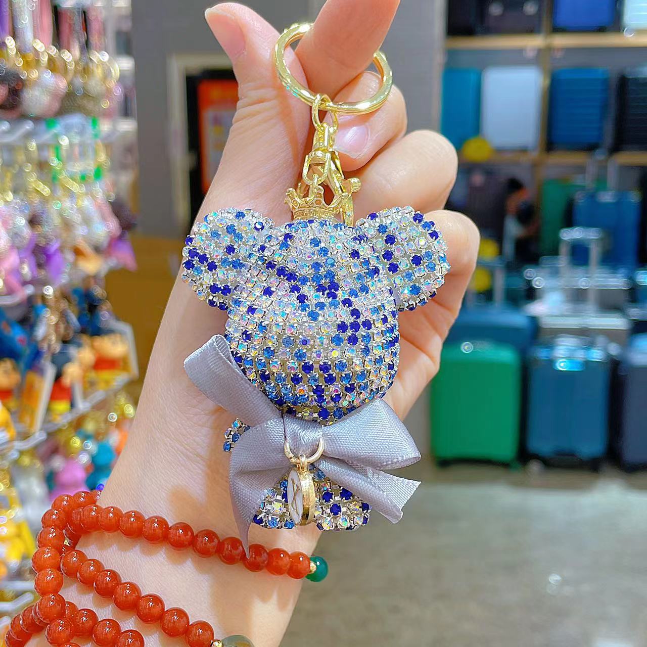Venta directa de fábrica de lujo completo diamante muñeca llavero pajarita cabeza grande oso completo diamante bolsa colgante coche llavero