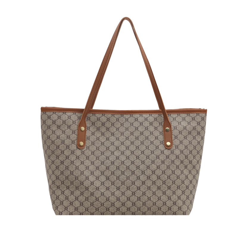Bolsos sencillos y de moda de gran capacidad para mujer 2025 primavera nuevo bolso de moda bolso de hombro portátil de gran capacidad para viajeros