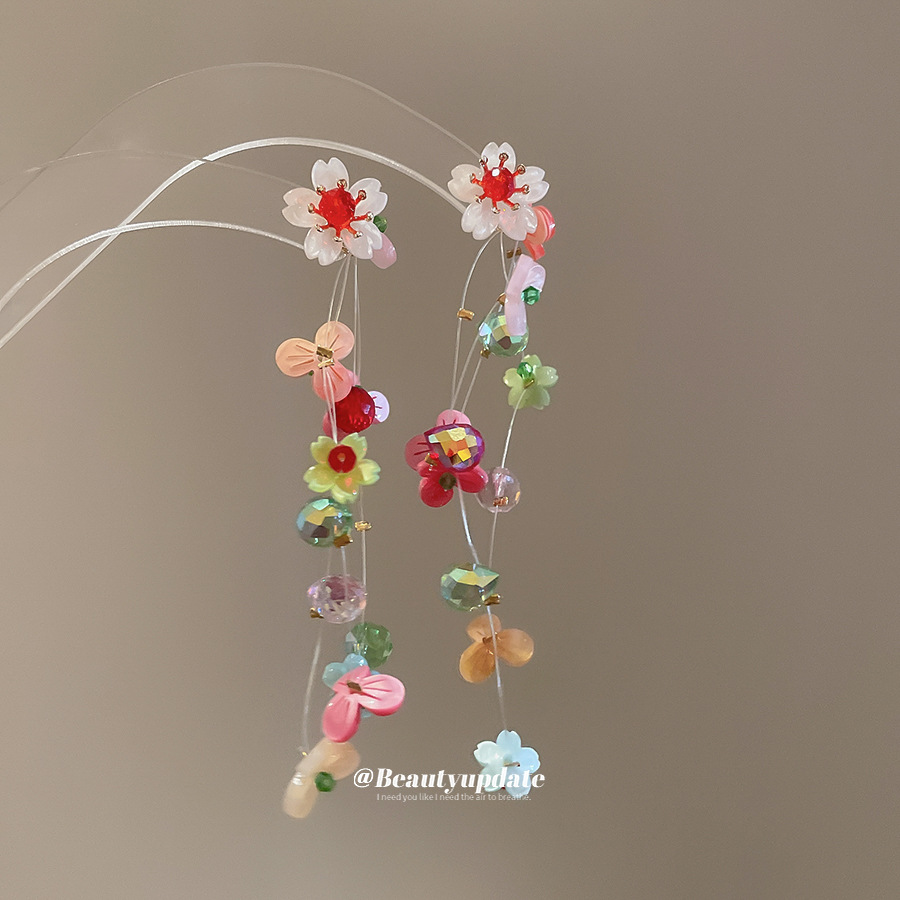 Pendientes de borla de flor de trompeta de color de aguja de plata Pendientes de estilo de vacaciones de verano Pendientes de todo fósforo de moda femenina Sentido de diseño nicho