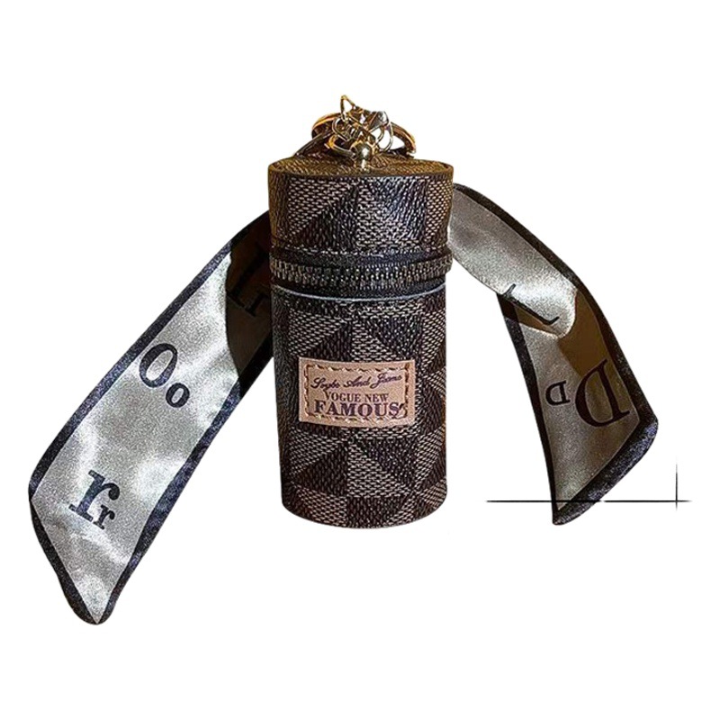 Bolsos para mujer 2025 nuevo retro presbicia llavero de cuero mini bolso de lápiz labial bolso de monedas con colgante de auriculares inteligentes.