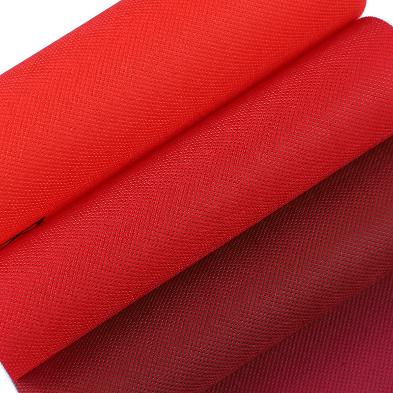 Fábrica de material PP no tejido spunbond rojo 80g 100g bolsa de almacenamiento de mano de compras no tejido rojo