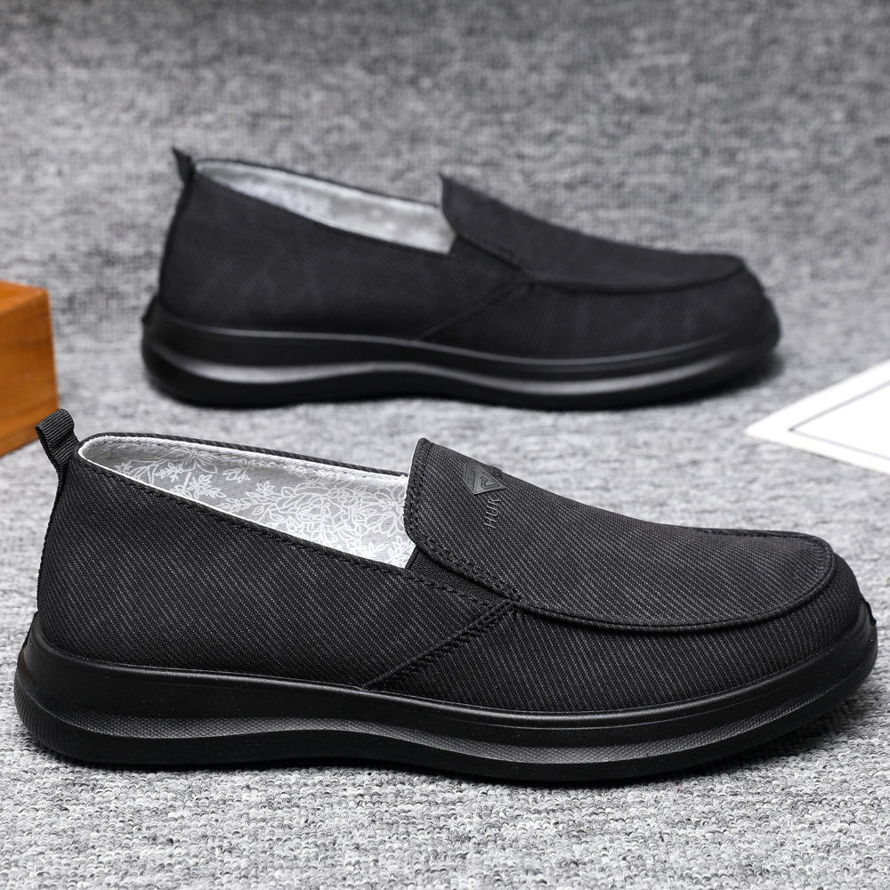 Zapatos de hombre primavera nuevos zapatos casuales cómodos de un pie zapatos de lona transpirables de suela suave zapatos de papá al por mayor