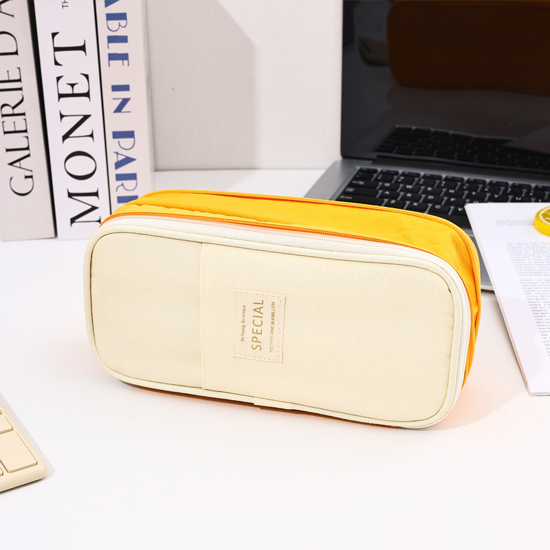 Bolso de lápices retráctil de lona de color de contraste de estilo explosivo transfronterizo Bolso de papelería de gran capacidad con doble cremallera simple multifuncional para estudiantes