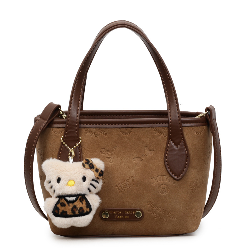 Corea del Sur super caliente retro bolso de mano de estilo extranjero para mujeres 2025 nueva moda simple hombro mochila bolso de cubo de moda