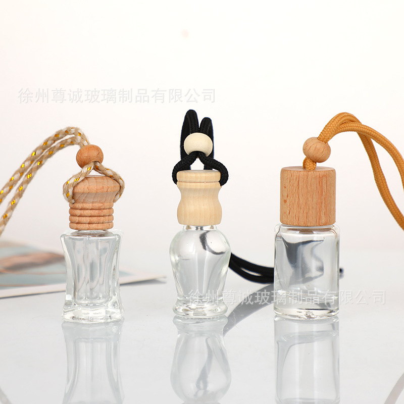 Botella de perfume de cables de automóvil botella vacía botella de perfume de automóvil colgante tapa de madera botella vacía perfumes volátiles al por mayor
