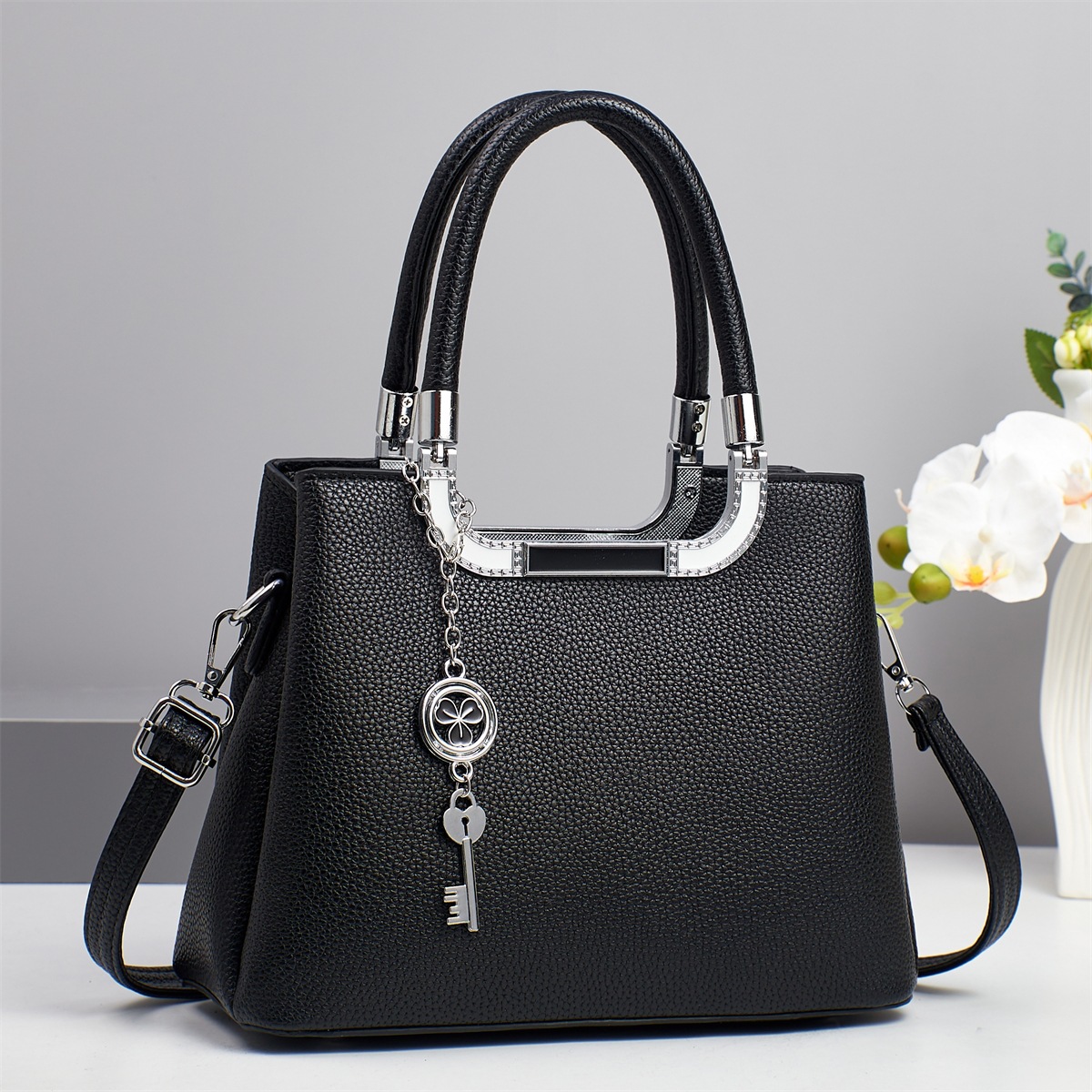 Bolso bandolera de todo fósforo nuevo patrón de lichi de gran capacidad sensación de alta calidad 2025 marca bolso atmosférico mujer de mediana edad