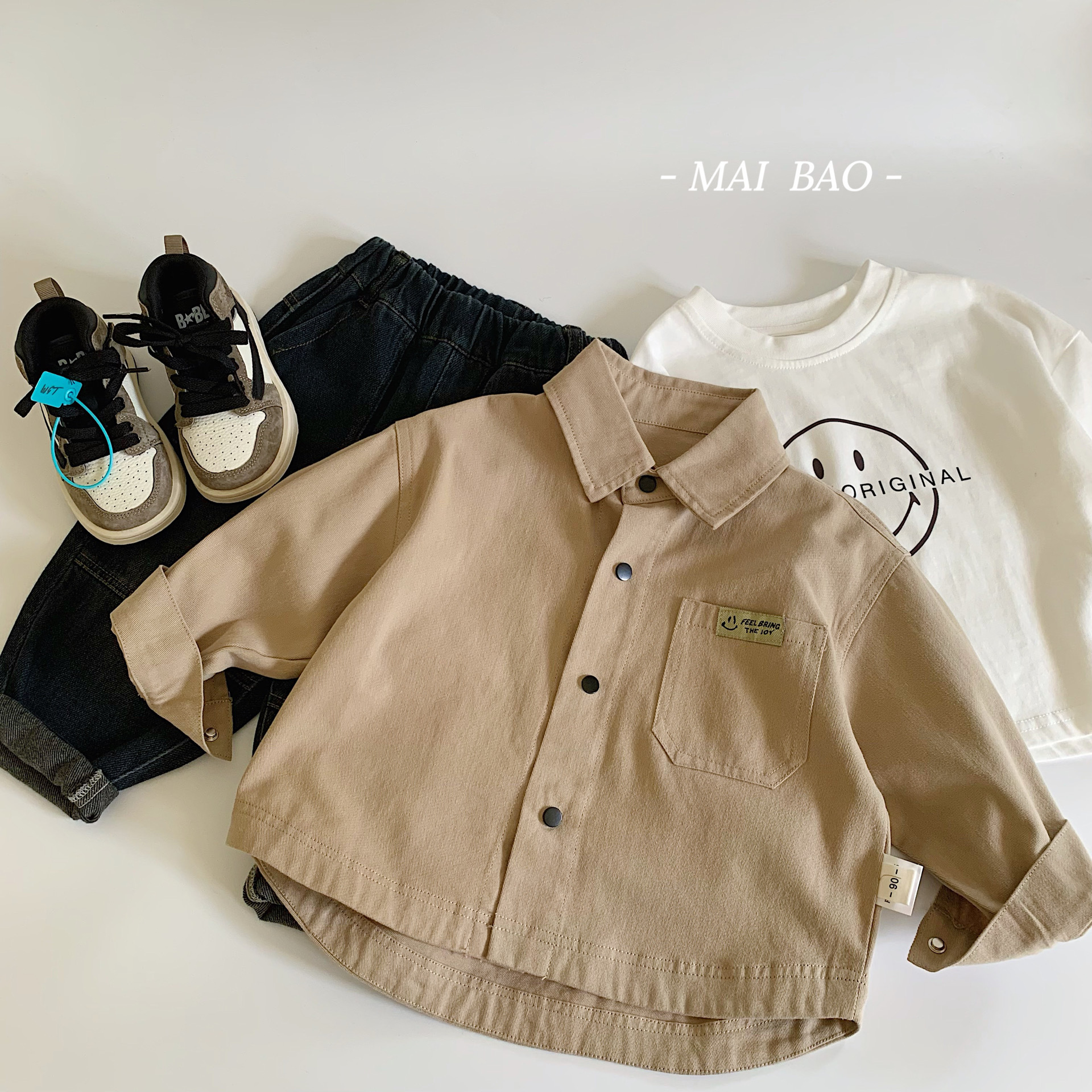 Mai Bao chaqueta infantil 2025 primavera nuevo bolsillo camisa calibrada para niños suelta estilo coreano simple camisa de estilo de moda