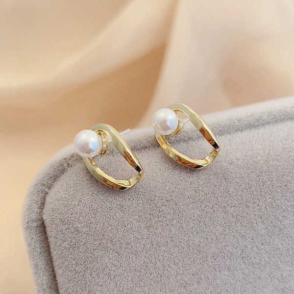 Golden small sophisticated earrings from pearl