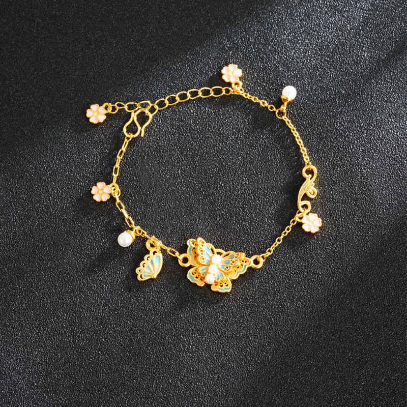 Nuevos productos multicapa mariposa alta sensación de perla de cerezo esmalte color esmaltado pulsera mariposa vida mujer accesorios versátiles suministro