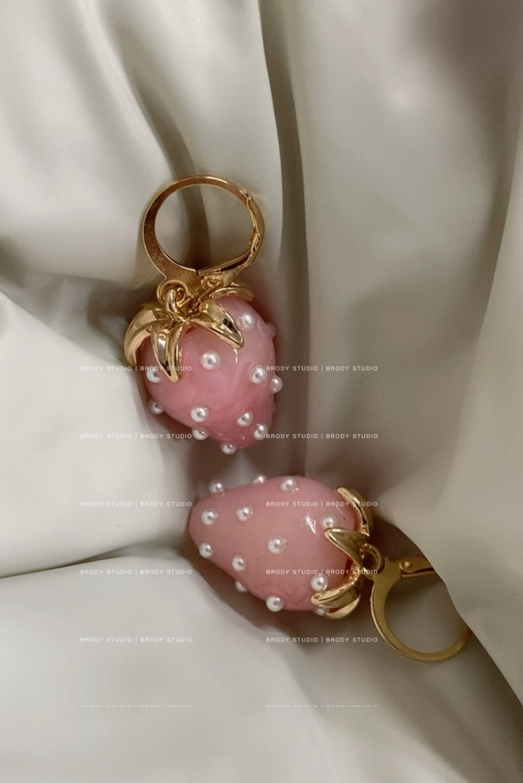 Cute fuchsia three dimensional strawberry