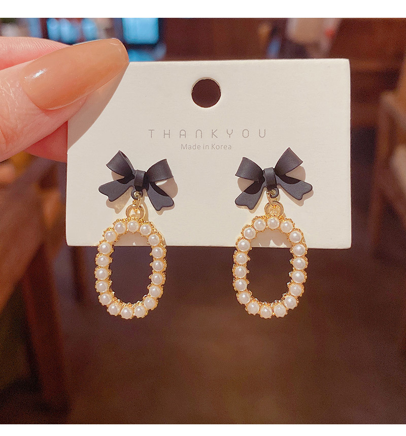 New Fashion Bow Inlaid Pearl Alloy Drop Earrings display picture 5