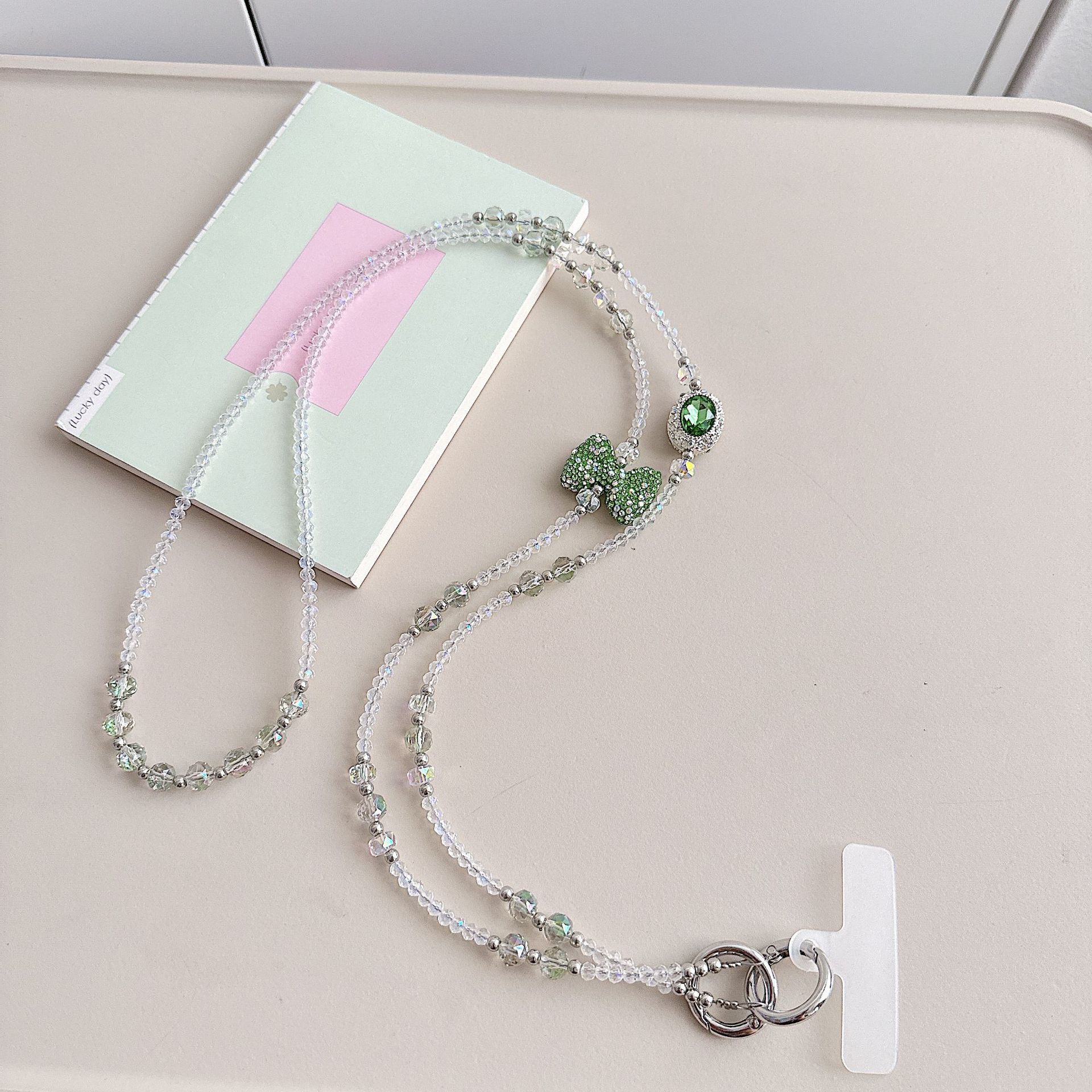 Boutique hecho a mano de alta gama teléfono móvil cadena colgante ins mujer ligero lujo dulce fresco estilo princesa moda teléfono móvil cadena colgante mensajero largo