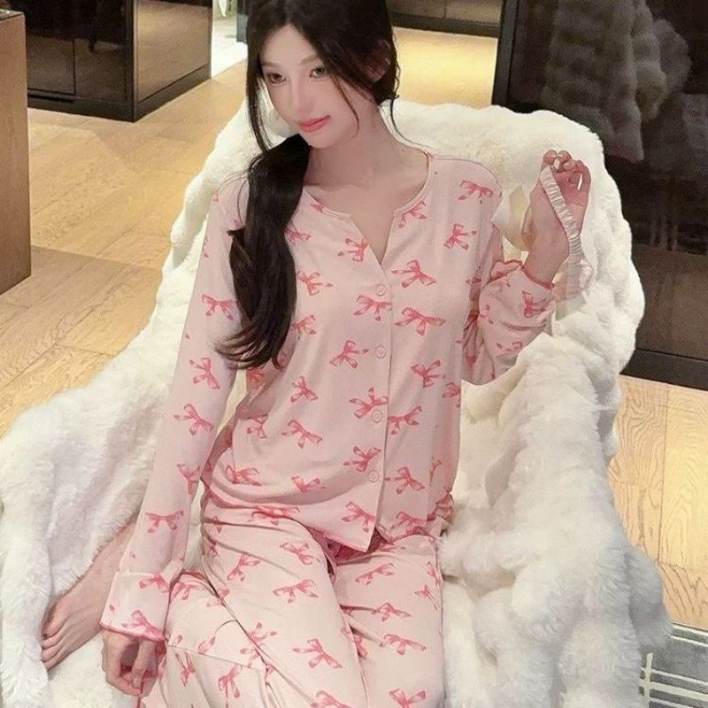 Pijamas al por mayor transfronterizos primavera y otoño nudos de seda de hielo hilo de moda cardigan de manga larga pantalones largos set de ropa para el hogar