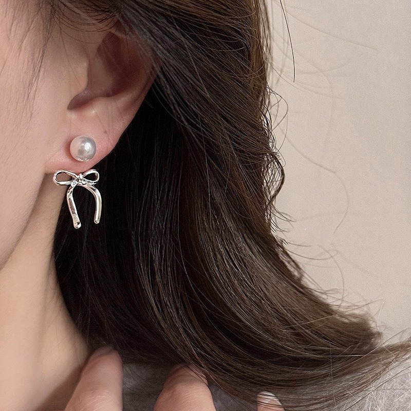 Organic sophisticated cute earrings from pearl with bow