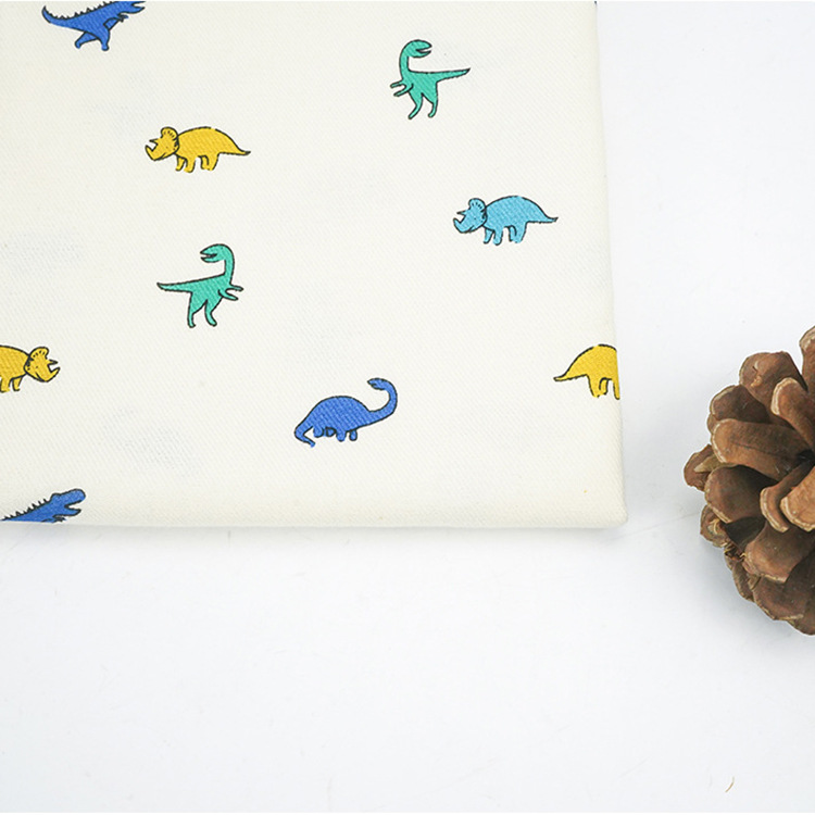 Roll textiles al por mayor 40s dinosaurios dibujos animados patrón de impresión digital ropa de algodón