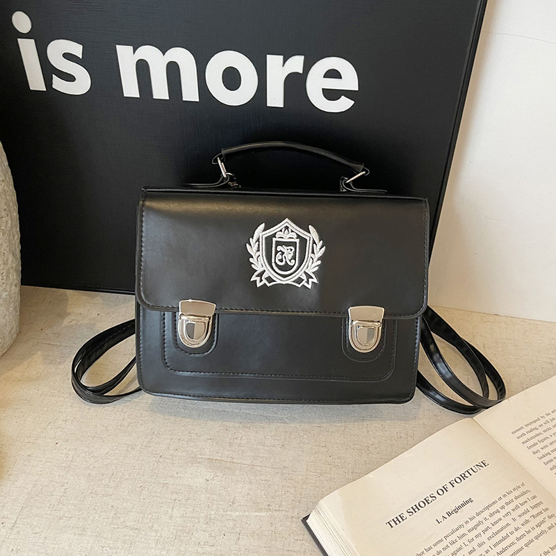 2025 nueva mochila de estilo universitario británico de estilo occidental, mochila de cartero de gran capacidad, bolso de mensajero de un solo hombro