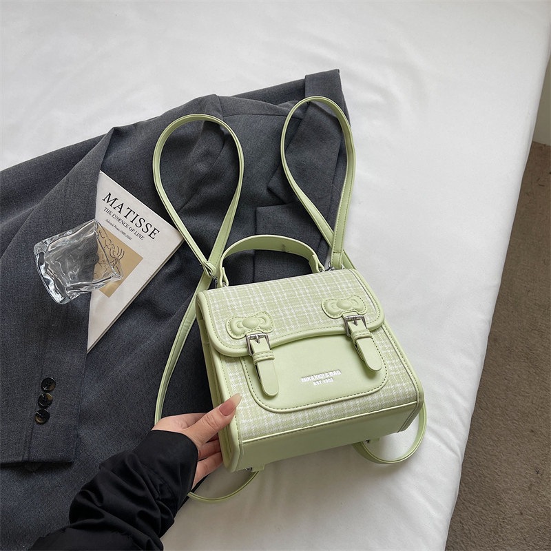 Mochila universitaria popular para estudiantes mochila casual de mujer estilo a cuadrícula nicho 2026 escuela de moda de verano nuevo estilo