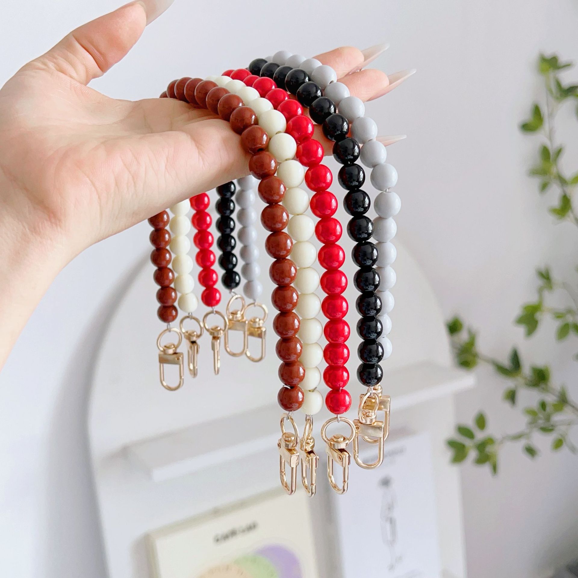 Nuevo estilo japonés y coreano cadena de cuentas de color sólido pulsera corta llavero bolsa de accesorios de cadena de perlas de todo fósforo cordón transfronterizo