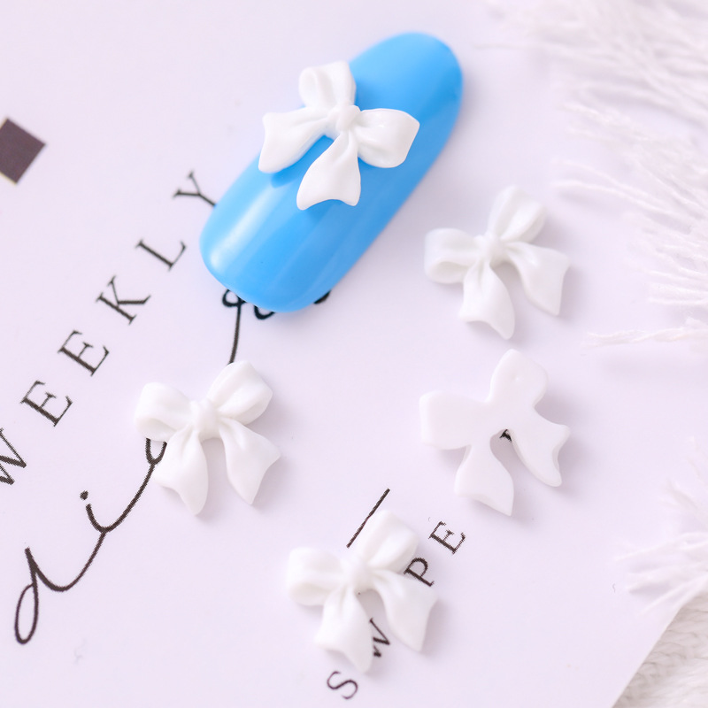 Mariposa de uñas popular repujado arco resina pajarita joyería simple todo partido tridimensional hueco decorativo diamante