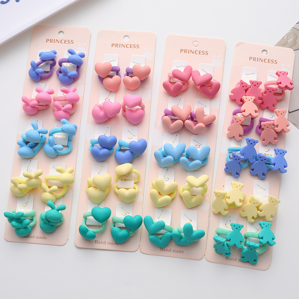 La alta elasticidad de los niños no duele la banda de goma de la cuerda del pelo del bebé de la banda linda del pelo del pulgar de la niña