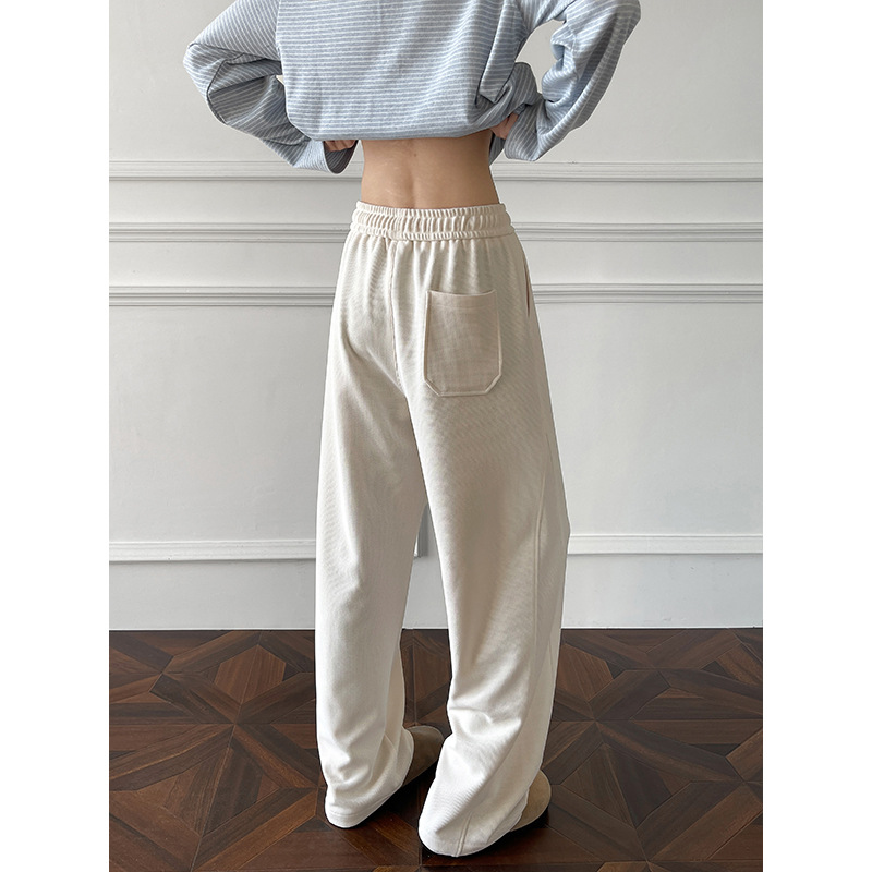 Pantaloni della tuta in stile americano con taglio obliquo e orlo curvo per uomo e donna, primavera, pesanti, vestibilità pulita, vestibilità ampia e casual di alta qualità._voghion.com