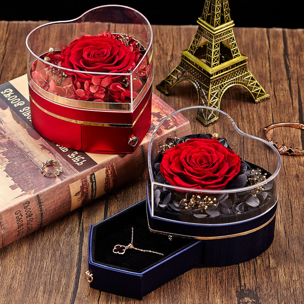 Acrylic ring heart shaped contains rose