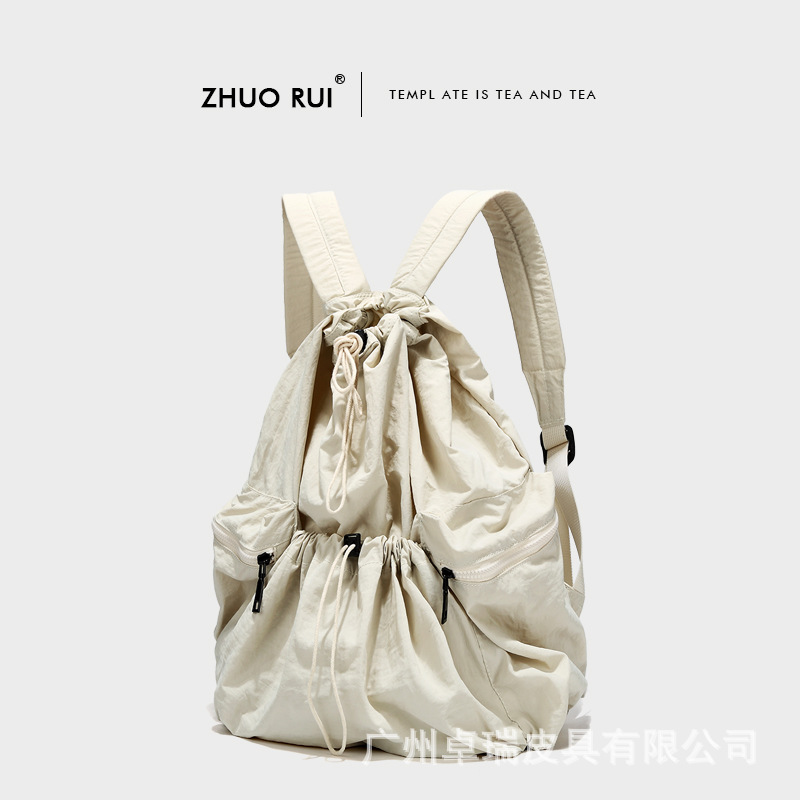 Corea del Sur Dongdaemun nuevo cordón mochila mujer casual gran capacidad estudiante mochila versátil mochila de nylon ligero