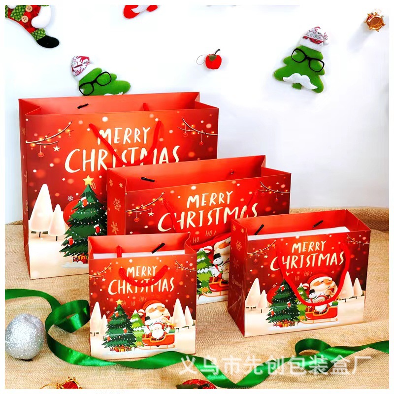 Nueva bolsa de regalo de Navidad bolso bolsa de papel al por mayor bolsa de regalo Portátil Bolsa de embalaje de dibujos animados