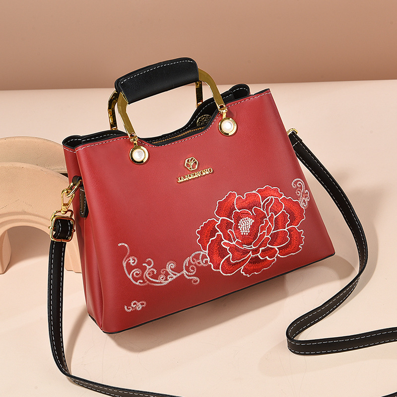 Regalo de temperamento de nicho para mamá 2025 nuevo estilo para suegra y ancianos bolso de hombro bordado elegante y de moda