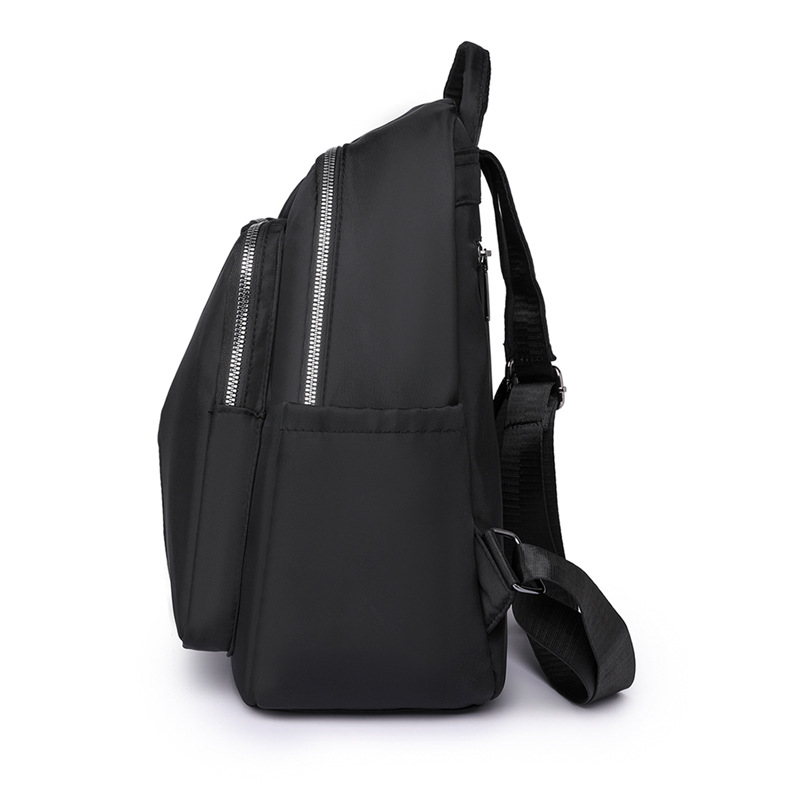 Spot al por mayor 2023 otoño nuevo estilo casual damas mochila de nailon al aire libre mochila de viaje ligera mochila escolar