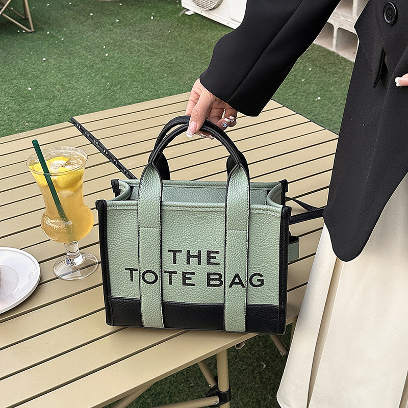 Bolso tote de comercio exterior para mujer 2023, nuevo bolso de mano moderno europeo y americano, bolso bandolera con estampado de letras y bloques de color.