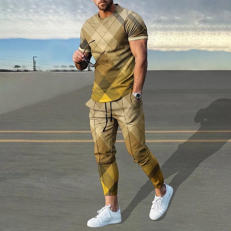 男性のスーツの夏の青年の半袖のtシャツのストライプは色のゆったりした弾力の薄い運動のズボンの2つのセットをつづり合わせます。|undefined