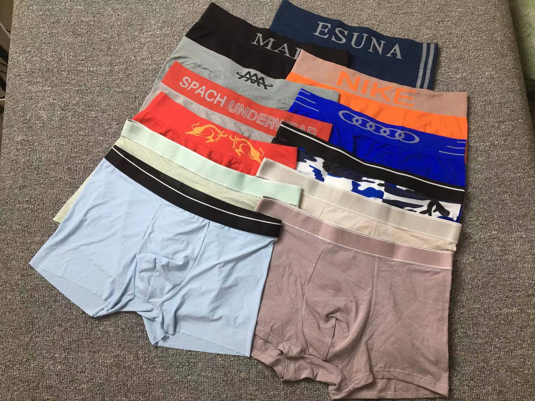 Diverso suelta más tamaño boxeadores ropa interior de moda al por mayor de los hombres El Comercio exterior europeo y americano sin costuras ropa interior ultrafina transpirable mezclado