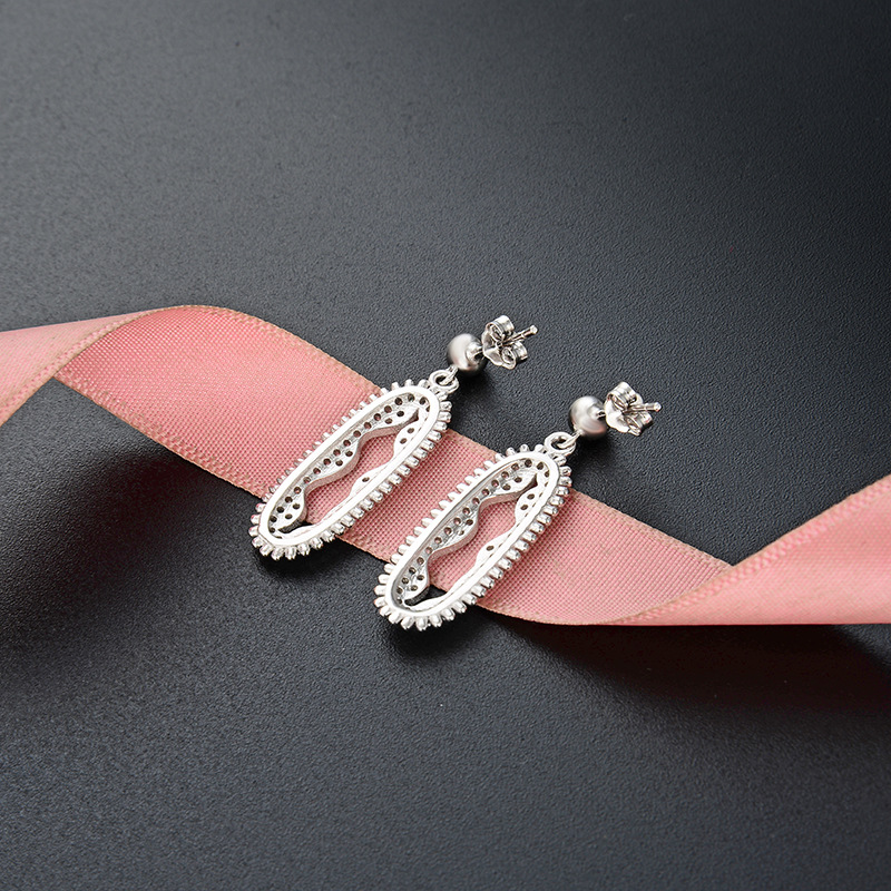 Joyas de moda europeas y estadounidenses de comercio exterior 925 plata esterlina damas geométrica exagerada hueco pendientes de zircón largos pernos