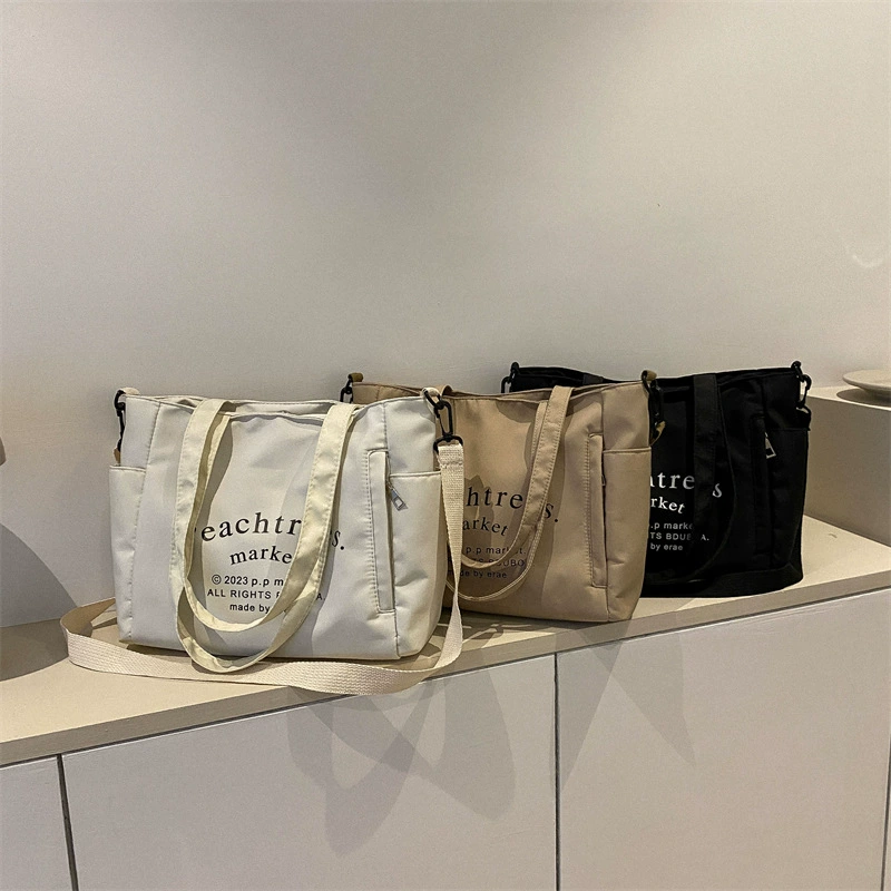 Fashionable retro one-shoulder city bag with increased thickness, available in black, white, and dark khaki