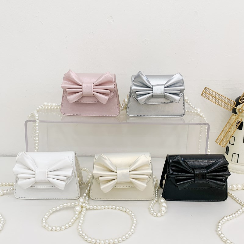 Coreano estilo extranjero mini niñas bolso de hombro lindo arco bebé mochila nueva moda bolso de cadena para niños