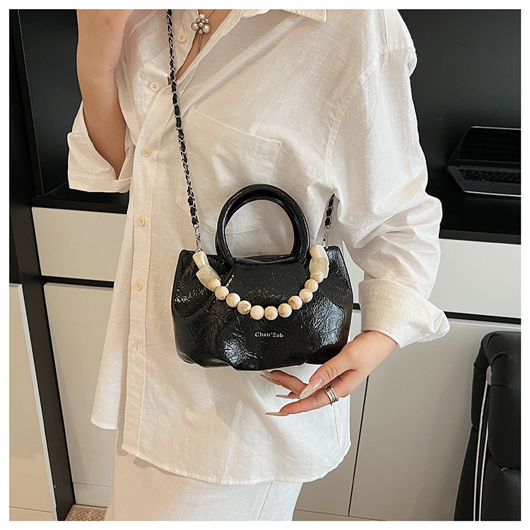 A stylish and trendy beaded bag for women, a new summer chain crossbody cloud bag for women in 2025 undefined