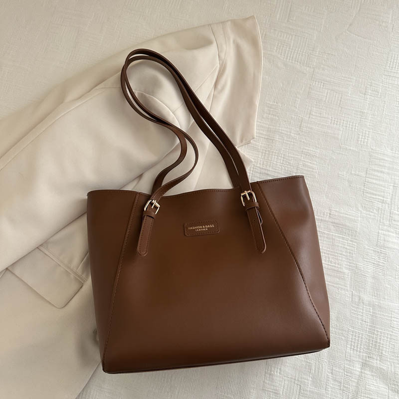 Bolsa de mano de viaje de color sólido bolsa de mano nueva alta alta capacidad axilar otoño y invierno 2024 bolsa de trabajo bolsa de mujer