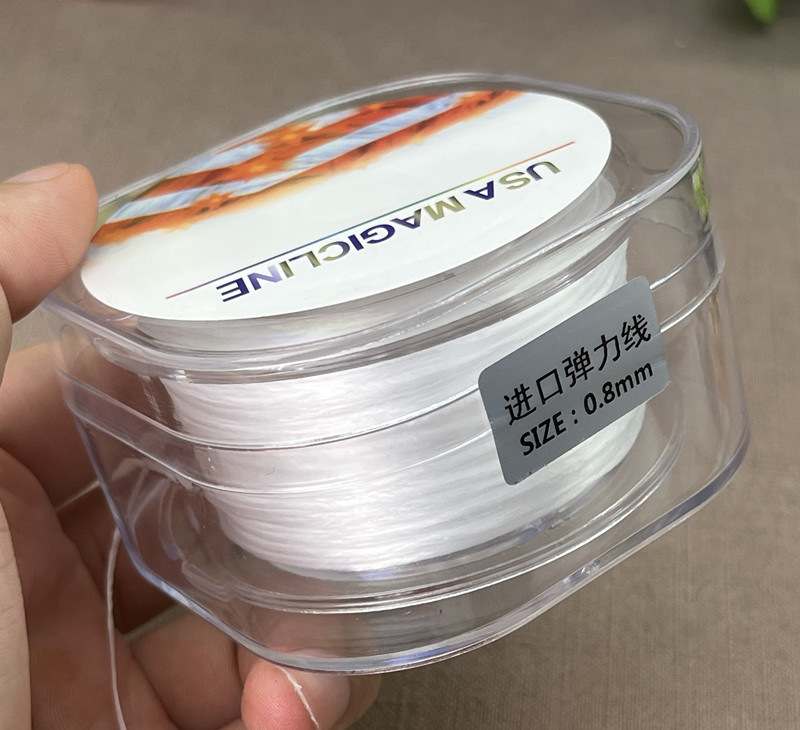 輸入の耐摩耗性のビーズの皮筋の手のひもは真珠の文を通して水晶の弾力性の線の超細い仏の玉の縄を遊びます。